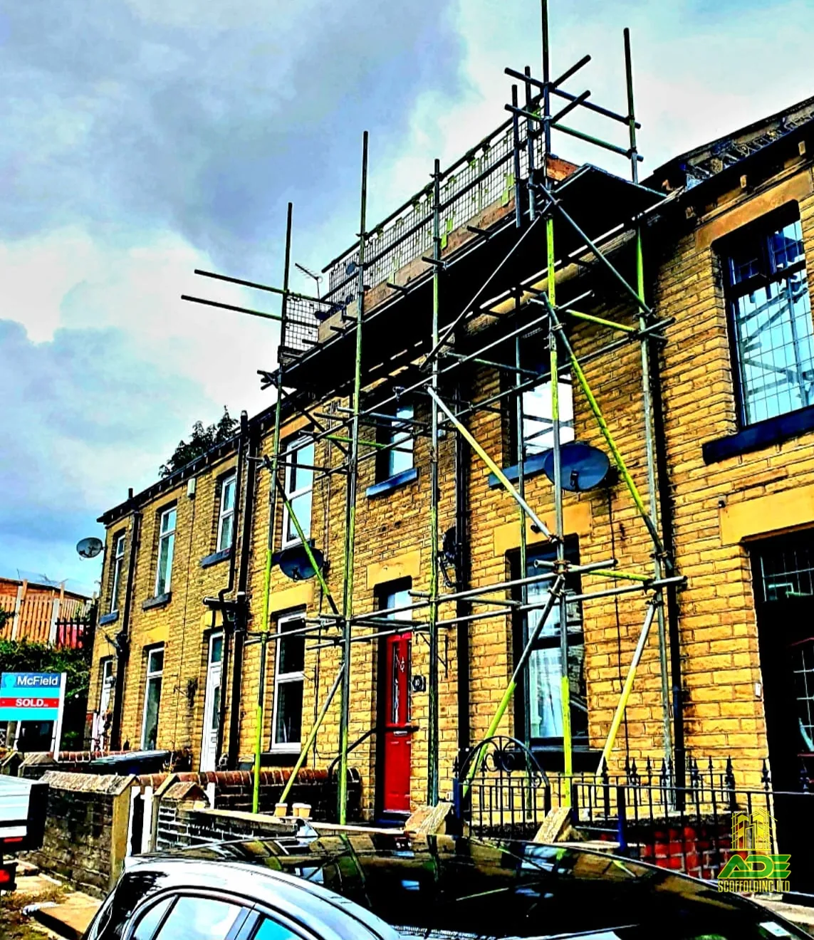 Two-lift chimney access scaffold on a Yorkshire stone terrace
